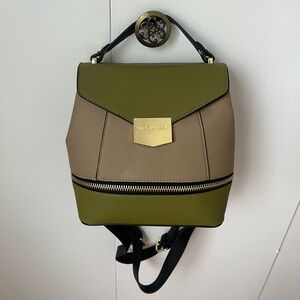 Olive and tan/beige bucket style backpack with adjustable and removable straps